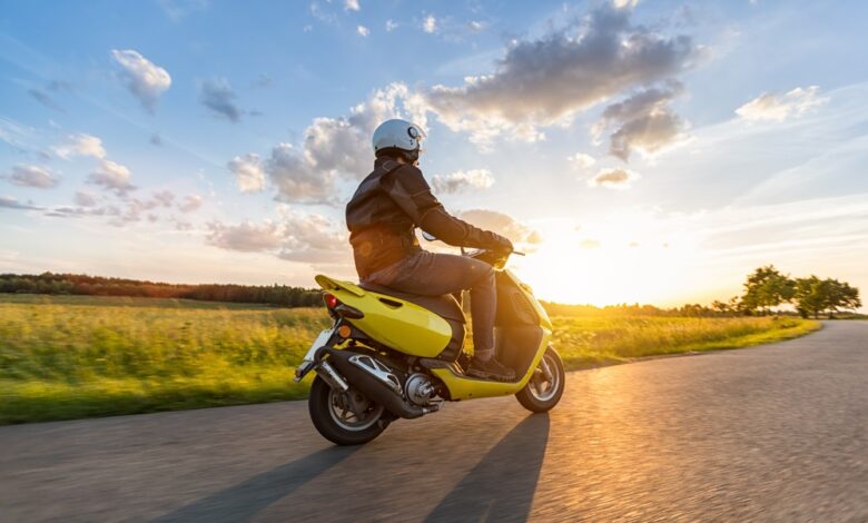 Motor,Biker,Riding,On,Empty,Road,With,Sunset,Light,,Concept